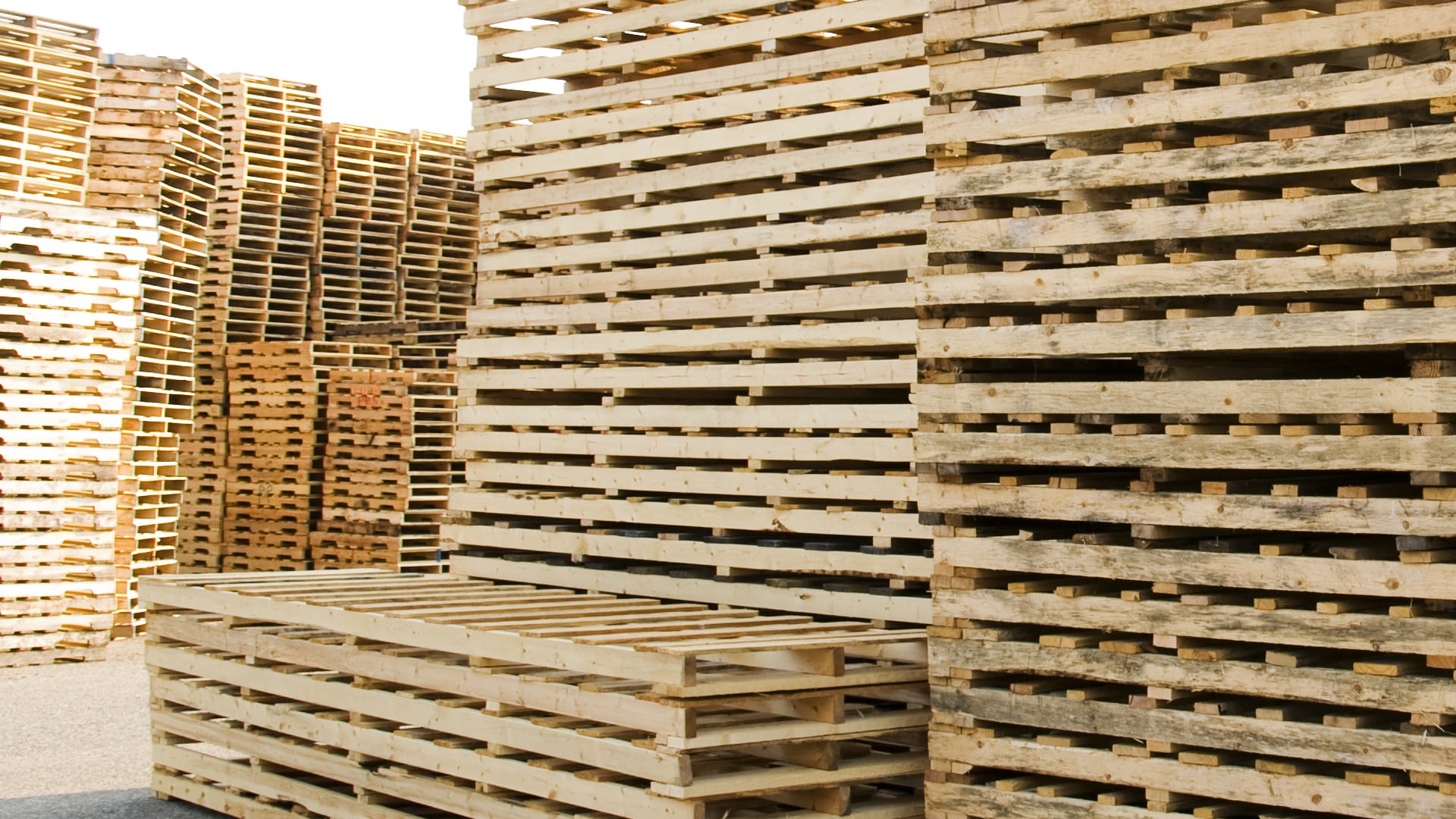 Stack of large wooden pallets outside