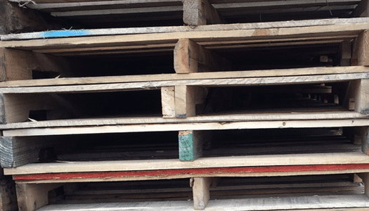 companion stringers example within a stack of repaired pallets