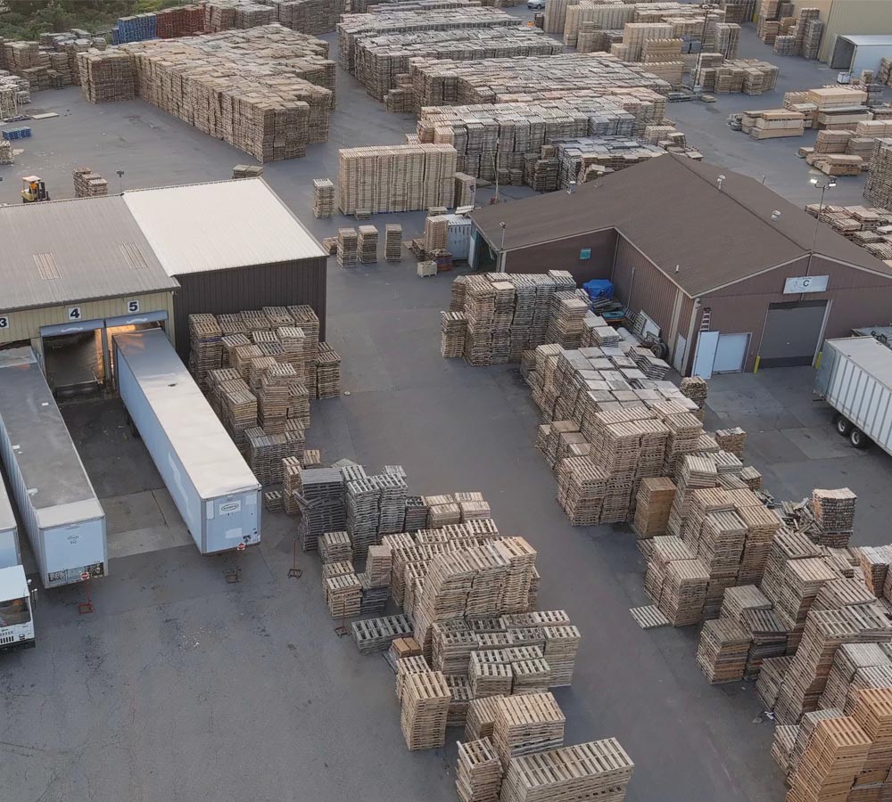 Aerial photo of trailers and wooden pallets in Kamps Grand Rapids facility