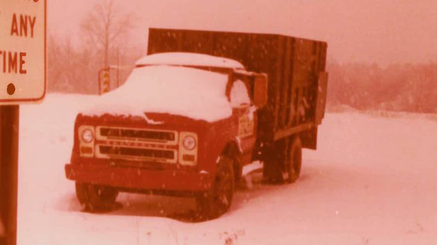 Kamps Pallets first red truck in the 1970s covered in snow