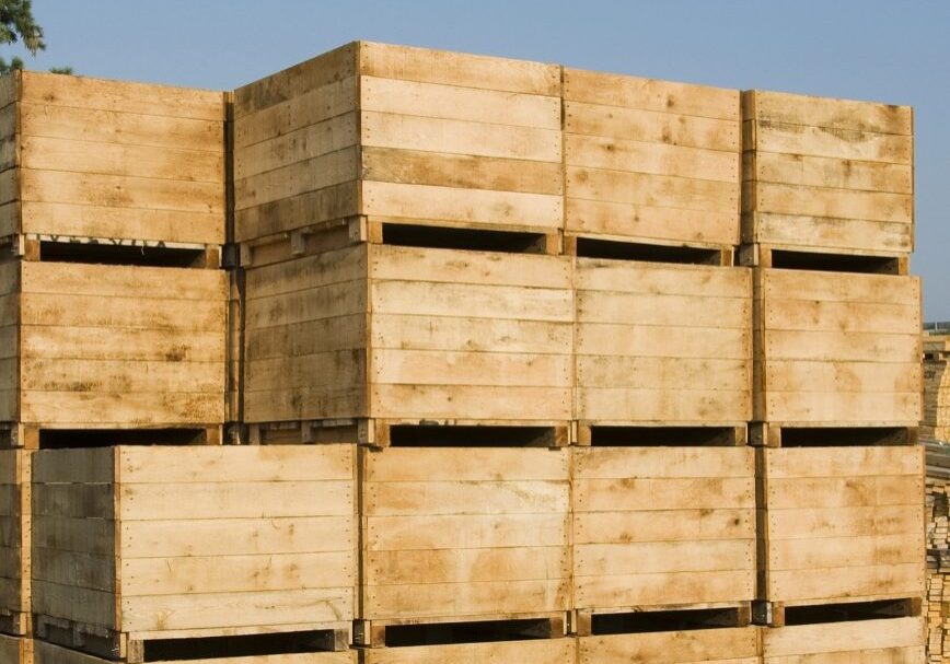 wooden shipping crates stacked outside